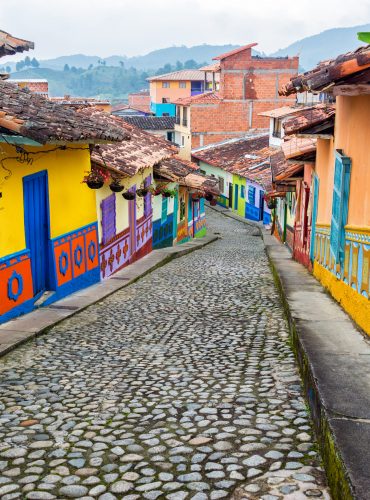 Colorful colonial houses on a cobblestone street in Guatape, Antioquia in Colombia